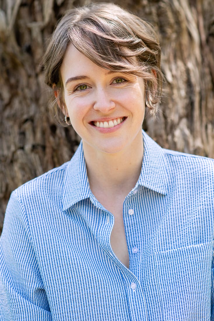 Melbourne actor headshot in natural light, while woman smiles at camera