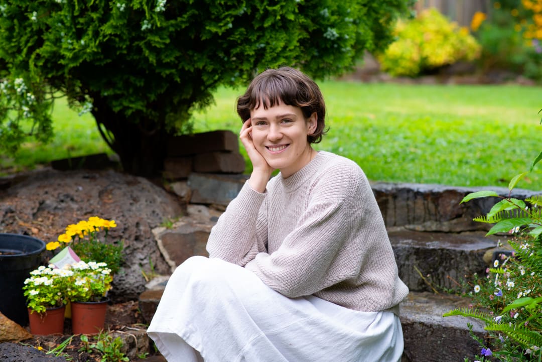 Personal branding portrait of Melbourne woman sitting in her garden