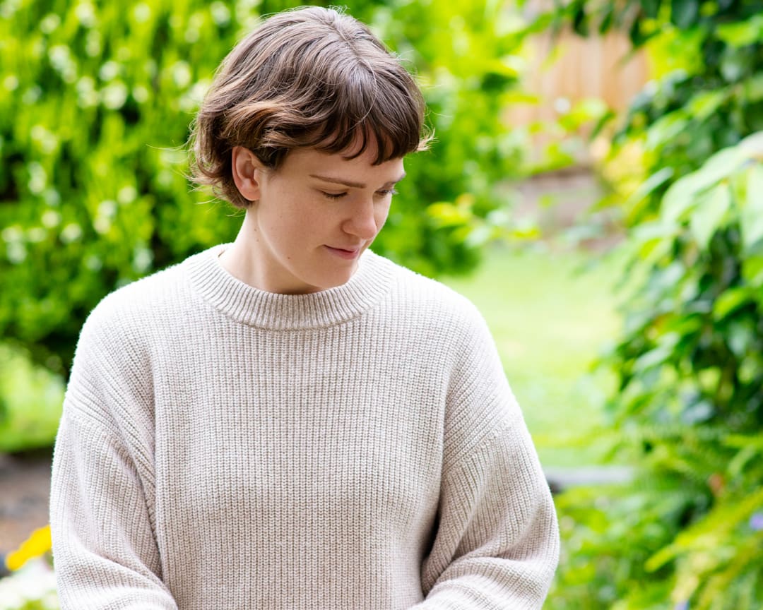 Woman smiling in garden for personal branding