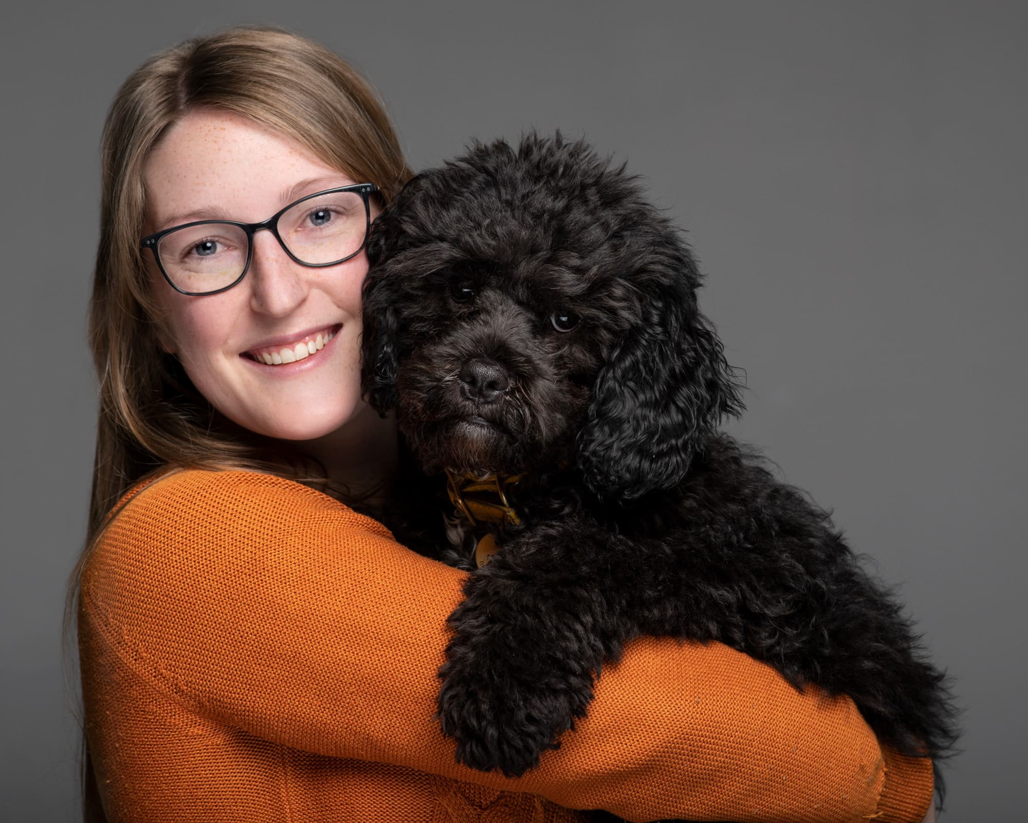 Julia photographed holding her dog Felix