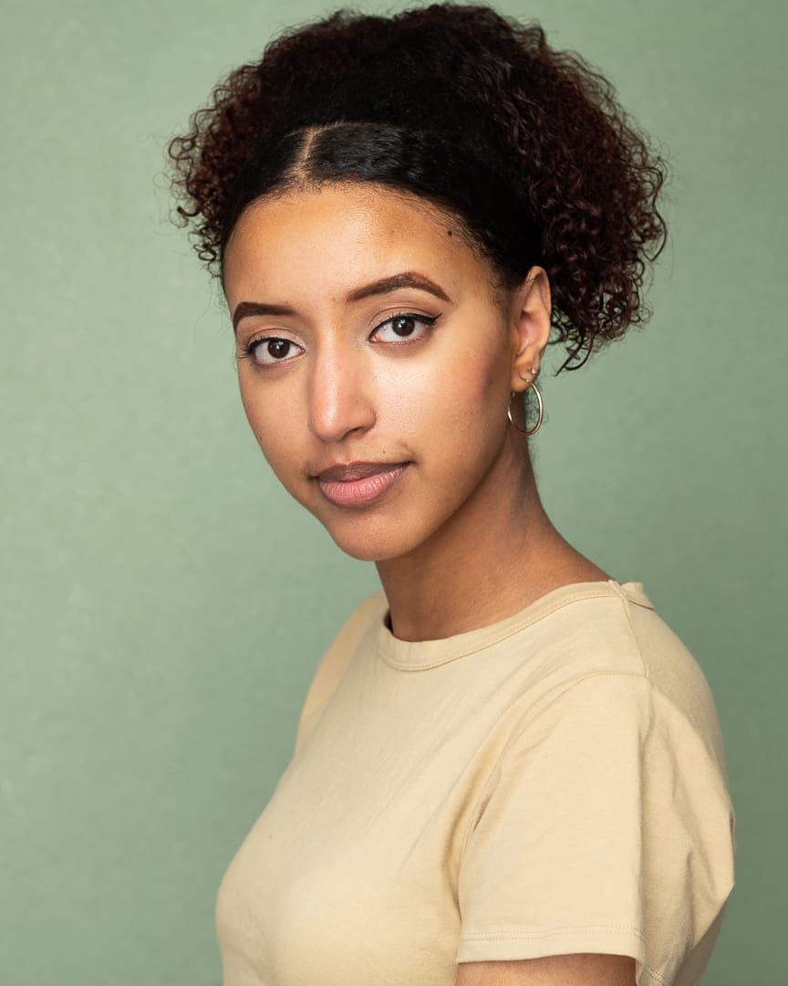 Melbourne actress looks to camera with serious and relaxed expression for acting headshot update.